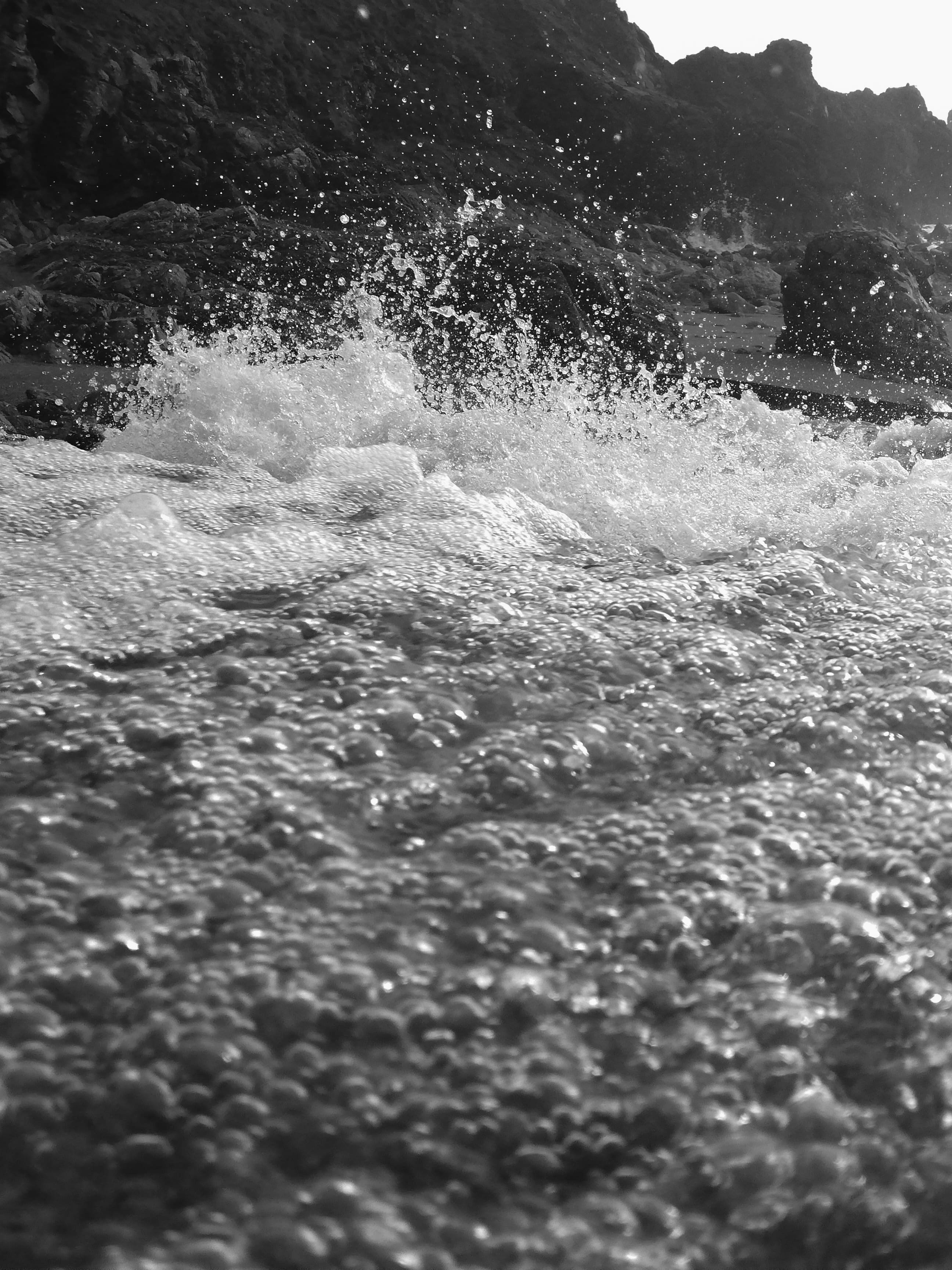 A shot of some sea foam and splashing water in a stream going into the sea